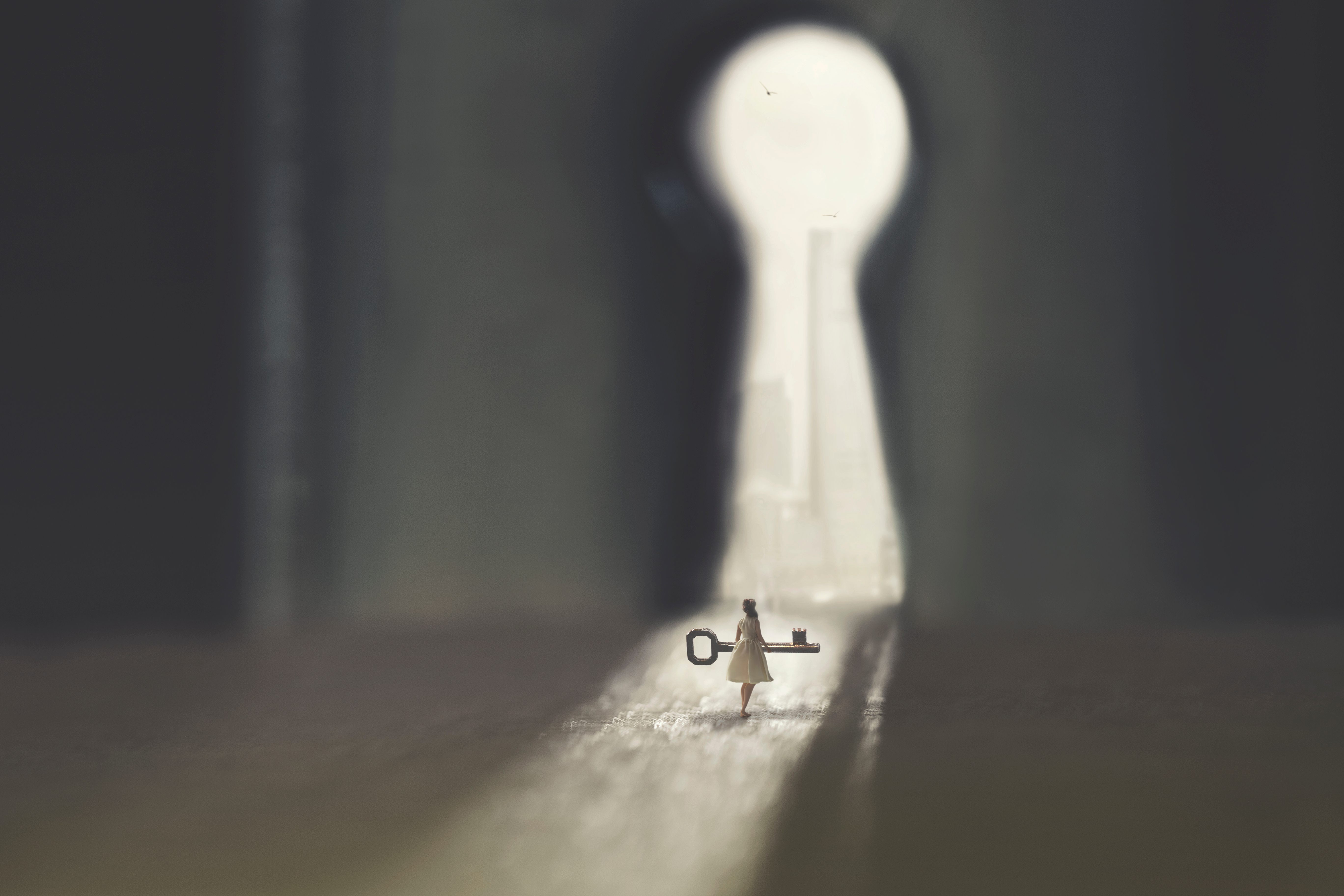 Girl, keyhole and key