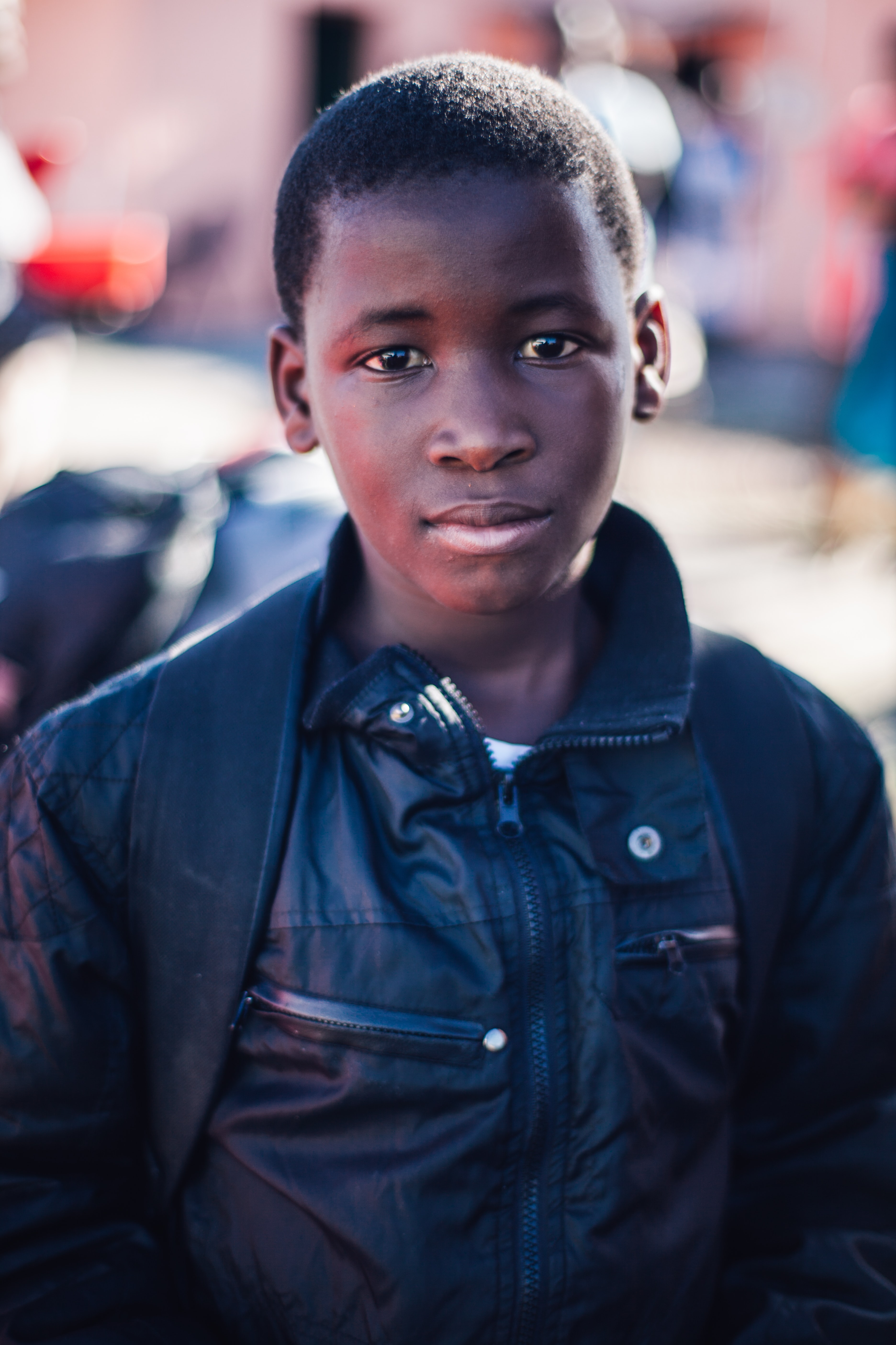 Black boy in black jacket (Katie Moum – Unsplash)