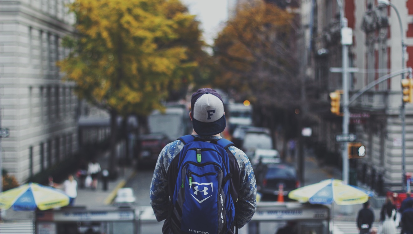 Male backview staring at street (Unsplash)