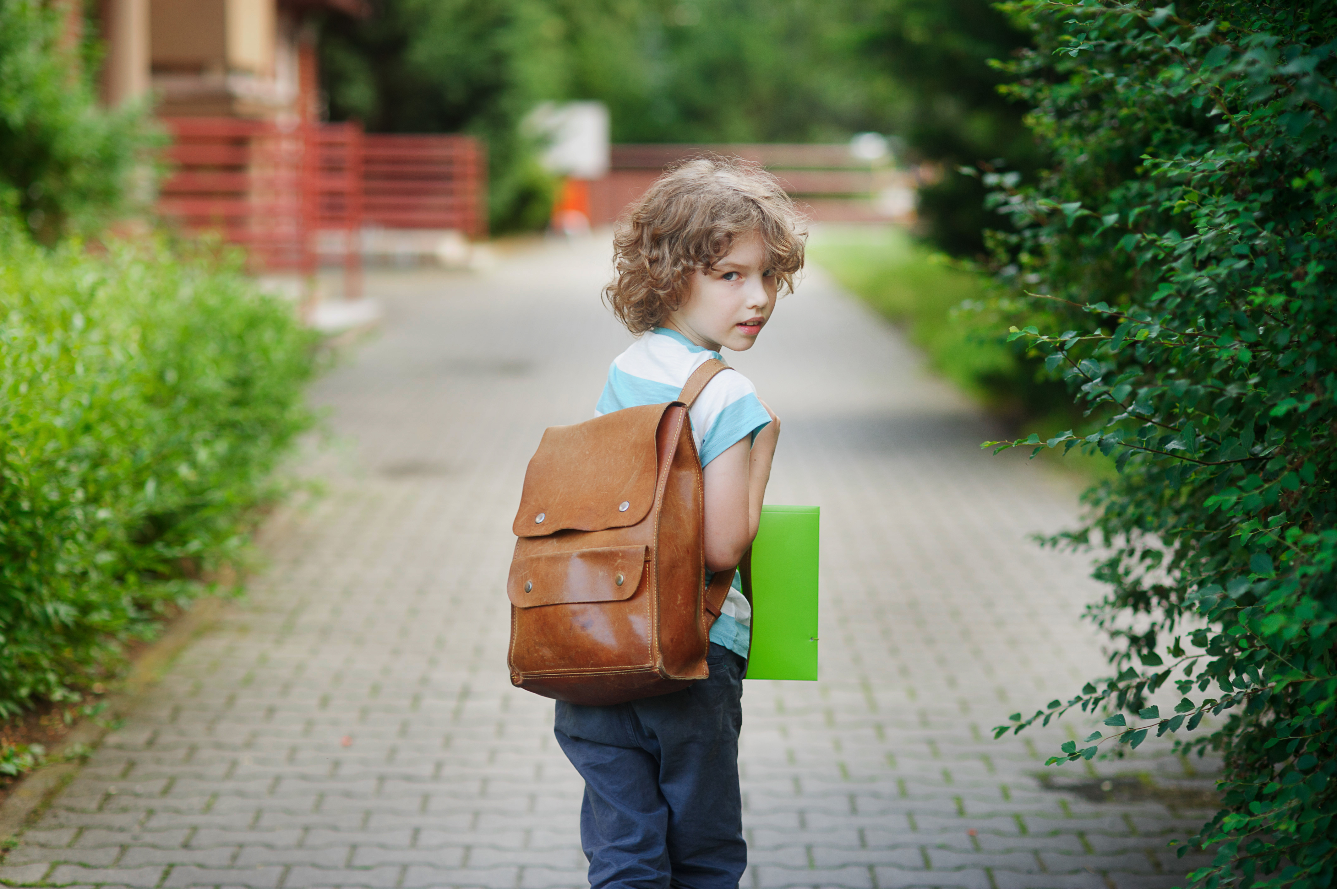 young-boy-looking-back-to-camera-shutterstock